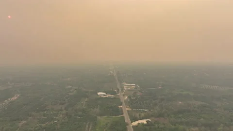 Drone View of Heavy PM2.5 Smog Over City and Orange Sky 動画素材 237014401