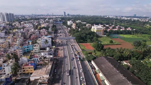 Drone view of Hebbal flyover surrounded by greenery and Bengaluru urban lan.. Stock Footage 339559627