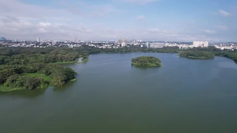 Drone view of Hebbal lake surrounded by greenery and urban landscape in Ben.. Stock Footage 339560283