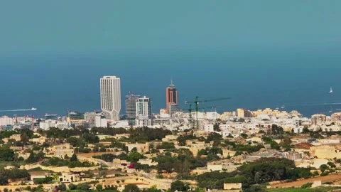 Drone view of highest buildings in Malta, St Julian's city and sea Stock Footage 277636425