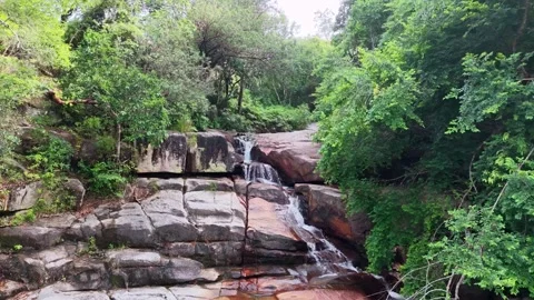Drone view highlights Batu Ferringhi Waterfall flowing 스톡 동영상 329367615