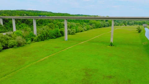 Drone View of Highway Bridge Over Forest and Meadow 動画素材 315497986