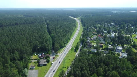 Drone view of highway cutting through forest Stock Footage 312861779