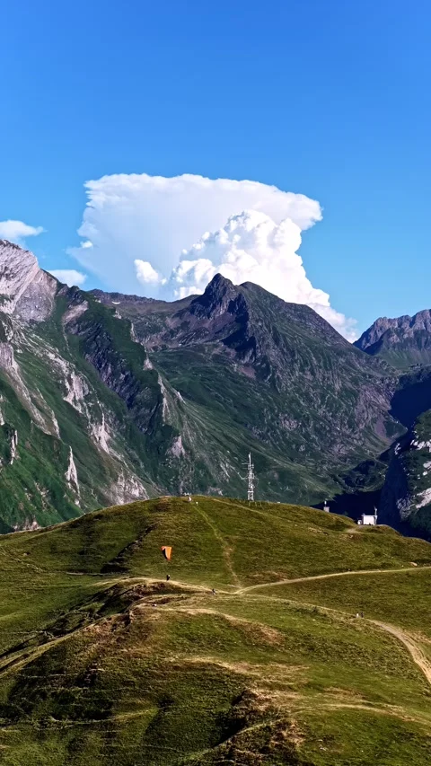 Drone view of hiking trails and a telecommunications tower in the French Alps Stock Footage 344530563