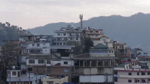Drone View of Hill Town Buildings With Mountain Background Stock Footage 331229039