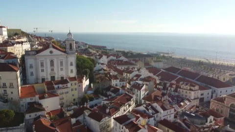 Drone view of hilly Lisbon on the coast of the Atlantic Ocean in sunny weather. Stock Footage 189327133