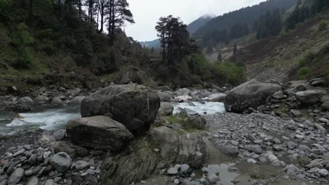 Drone View of Himalayan River with Giant Rock in Scenic Valley Video stock 313382508