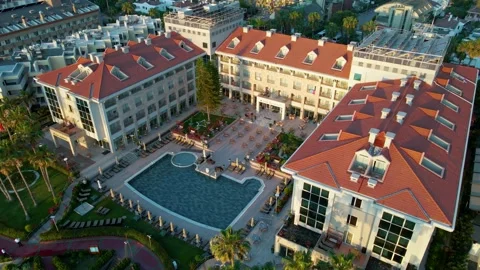 Drone view of hotels with swimming pool, turkey, kemer, dawn, 4k Stock Footage 217861639
