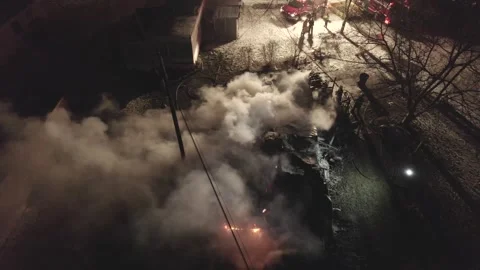 Drone View Of A House On Fire At Night. Firefighter On-Site To Extinguish. 库存影片 347659220