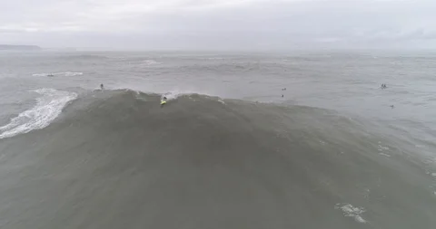 Drone view of a huge wave in Nazaré, Portugal Stock Footage 111834555
