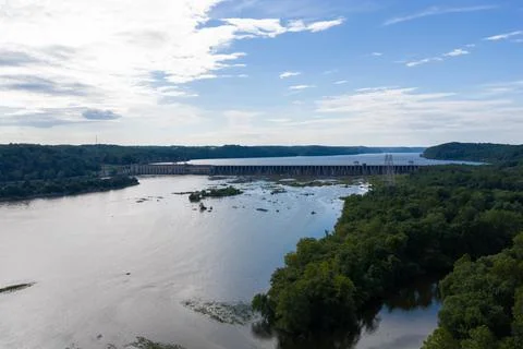 Drone view of a hydroelectric dam and power plant on a wide river 写真素材