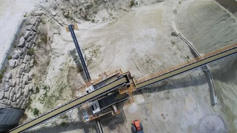 Drone view of industrial conveyor system in quarry. Belt conveyor in sand 動画素材 213667215