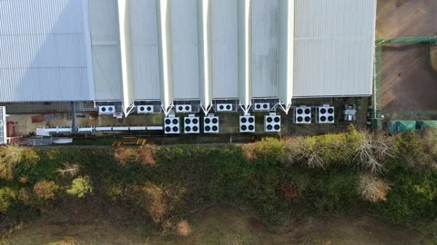 Drone view of industrial-grade cooling systems at a Milton Keynes facility Stock Footage 333021888