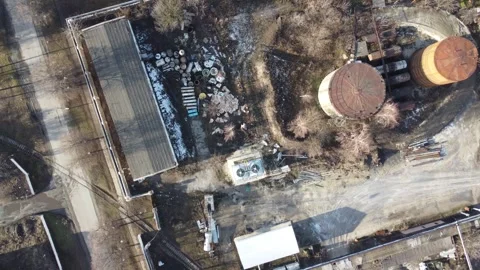 Drone view of an industrial zone with scrap metal and storage facilities. Stock Footage 298569384