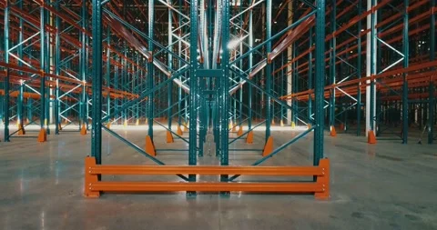 Drone view inside warehouse. Rows of metallic frameworks. Camera going up. Video stock 135131067