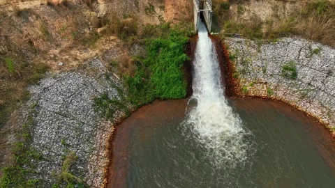 Drone view of irrigation water cascading into a pond. Stock Footage 331279684