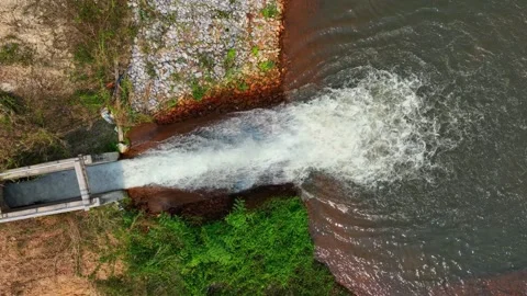 Drone view of irrigation water cascading into a pond. Stock Footage 331279726