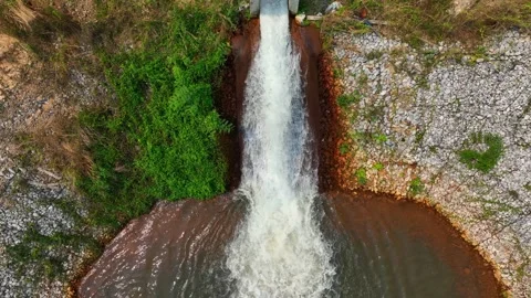 Drone view of irrigation water cascading into a pond. Stock Footage 331279744