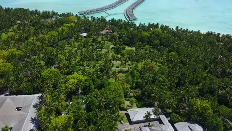 Drone view to the island in the midle of the ocean with blue lagoon 4K Video stock 120690108