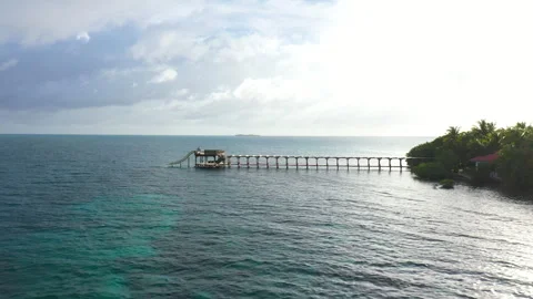 Drone View of Island Ocean Pier with Water Slide at Sunset 스톡 동영상 300272811