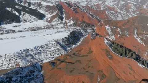 Drone view of Jeti Oguz Seven Bulls red rock cliffs in winter, Kyrgyzstan Stock Footage 336295947