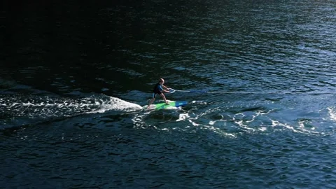 Drone view of kid doing wake board in the sea. Stock Footage 158955796