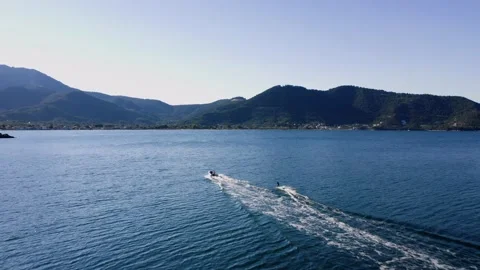 Drone view of kid doing water ski in the sea. Stock Footage 158953588
