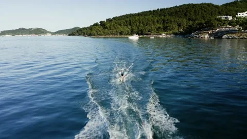 Drone view of kid doing water ski in the sea. Stock Footage 158954141
