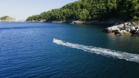 Drone view of kid doing water ski in the sea. Video stock 158954955