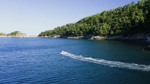 Drone view of kid doing water ski in the sea. Stock Footage 158955857