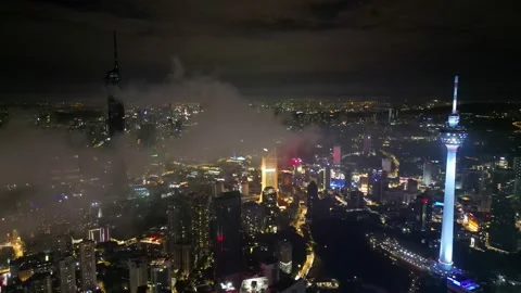 Drone view KL Tower, PNB 118 in night view during low cloud Stock Footage 221740225