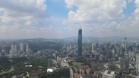 Drone view of KL Tower, Warisan Merdeka Tower and Kuala Lumpur city centre Stock Footage 148496055