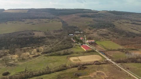 Drone view of the Köröshegy State Stud Farm amid winter pasture fields Stock Footage 337507656