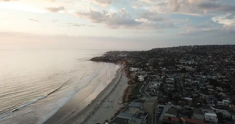 Drone View - La Jolla Birdrock San Diego and Pacific Ocean Panning to Sunset Video stock 95906232