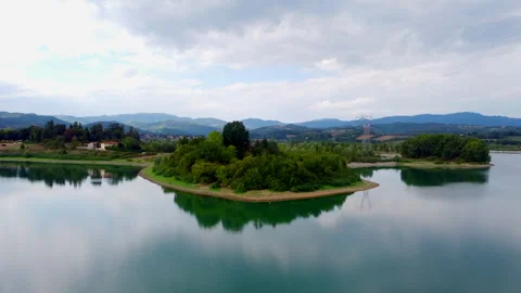 Drone view of lake in tuscany under variable sky Stock Footage 320844187