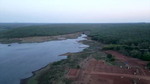 Drone view of lakes and forest on the large tranquil plain of Long Thanh Lakes Stock Footage 278489272