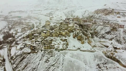 Drone view of Lamayuru Monastery's rooftops dusted with snow. Stock Footage 310661049
