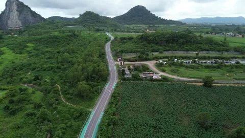 Drone view of a landscape with a Buddha statue on a hill Stock Footage 278943001
