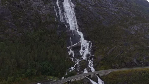 Drone view of Langfossen waterfall plunging through cliffs in Norway Stock Footage 320245114