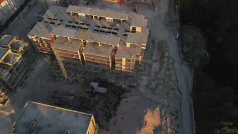 Drone view of large construction site on Sunset located along seashore Vídeo Stock 268870311