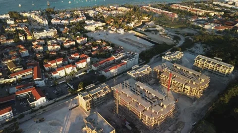 Drone view of large construction site on Sunset located along seashore Stock Footage 268870586
