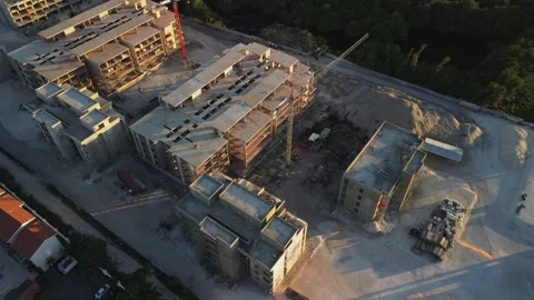 Drone view of large construction site on Sunset located along seashore Stock Footage 268870766