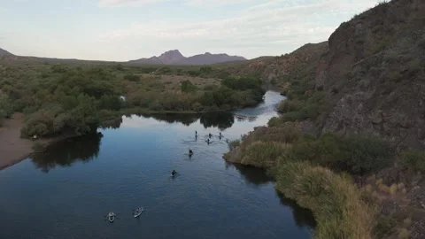 Drone View Of Large Group Of People Paddle Boarding On The Salt River In Arizona Stock Footage 282616162