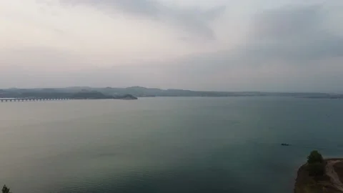 Drone view of a large lake from above in the evening Stock Footage 229967395