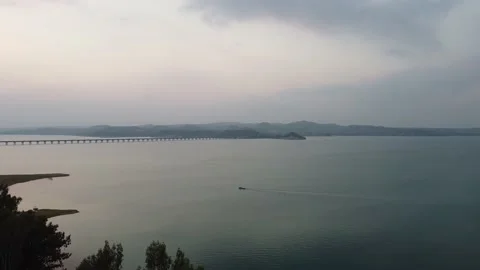 Drone view of a large lake from above in the evening Stock Footage 229967422