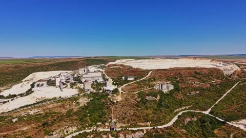 Drone view of a large quarry and surrounding area in daylight Stock Footage 341327513
