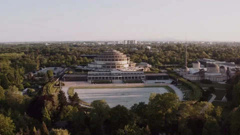 Drone view of a large, spherical building in a green park. Stock Footage 146096688