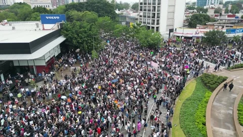 Drone view of a large water march filling streets around La Minerva roundabout Video stock 347570132