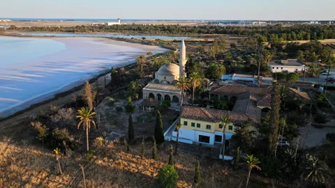 Drone view of Larnaca Salt Lake in Cyprus with Hala Sultan Tekke Mosque nearby. Stock Footage 341538285