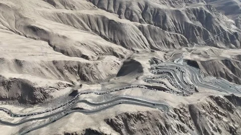 Drone view of layered badlands and desert canyon landscape in Xinjiang China Stock Footage 337674941